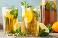 Traditional iced tea with lemon and ice in tall glasses on a wooden rustic table. With copy space Royalty Free Stock Photo