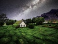 Traditional Icelandic houses with grass roof. A colorful starry sky above them