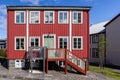 Traditional Icelandic ironclad red residential house with white window frames, Reykjavik, Iceland