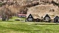 Traditional icelandic turf houses (icelandic: torfbaeir) near the famous skogafoss waterfall in Iceland.