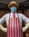 Butchers Statue Wearing a Face Mask during the Coronavirus Pandemic