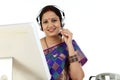 Traditional Indian business woman wearing headset Royalty Free Stock Photo