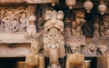 Traditional Indian carvings of past centuries. Animal head and ancient people on wooden wall, old Hindu temple in India Royalty Free Stock Photo