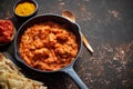 Traditional Indian chicken tikka masala spicy curry meat food in cast iron pan Royalty Free Stock Photo