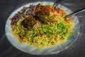 Traditional Indian cuisine. Briani. Multicolored rice in a plate