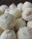 Traditional Indian dessert coconut balls / nariyal ladoos filled with lots of raisins