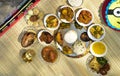 Traditional Indian dishes Paes and misti doi , blurred rice and non veg Bengali meal. Special food preparation for rice ceremony Royalty Free Stock Photo