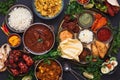 Traditional Indian dishes and snacks in an authentic copper serving bowls