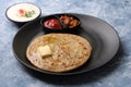 Traditional Indian food Aloo paratha or potato stuffed flat bread. served with pickle Royalty Free Stock Photo