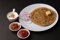 Traditional Indian food Aloo paratha or potato stuffed flat bread. served with pickle Royalty Free Stock Photo