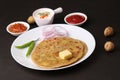 Traditional Indian food Aloo paratha or potato stuffed flat bread. served with pickle Royalty Free Stock Photo