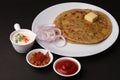 Traditional Indian food Aloo paratha or potato stuffed flat bread. served with pickle Royalty Free Stock Photo