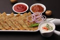 Traditional Indian food Aloo paratha or potato stuffed flat bread. served with pickle Royalty Free Stock Photo