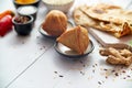 Traditional Indian Food snack Samosa served in a plate on a white wooden table