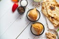 Traditional Indian Food snack Samosa served in a plate on a white wooden table