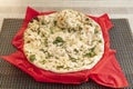 Traditional indian garlic naan made in a pakistani restaurant in europe with mucho parsley and sesame seeds