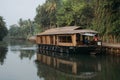 Houseboat is floating by the river in Aleppey/Kerala/India