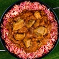 Traditional Indian Lamb Curry With Pink Pilau Rice Royalty Free Stock Photo