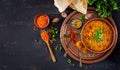 Traditional Indian soup lentils. Indian Dhal spicy curry in bowl, spices, herbs Royalty Free Stock Photo