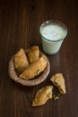 Traditional indian sweet Gujiya served with spiced milk. Royalty Free Stock Photo