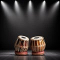 Traditional Indian Tabla Drums Set Illuminated by Dramatic Stage Spotlights on Dark Floor Royalty Free Stock Photo