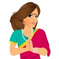 Traditional Indian woman holding hands in prayer position