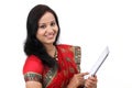 Traditional Indian woman holding a laptop computer Royalty Free Stock Photo