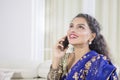 Traditional Indian woman speaking on a phone Royalty Free Stock Photo