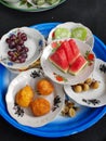 traditional Indonesian culinary delights, traditional snacks and watermelon, duku fruit and grapes