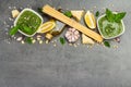 Traditional ingredients for the preparation of classic Italian pasta. Dry spaghetti, basil pesto Royalty Free Stock Photo