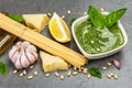 Traditional ingredients for the preparation of classic Italian pasta. Dry spaghetti, basil pesto Royalty Free Stock Photo