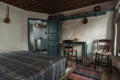 Traditional interior of old bedroom with handmade wooden furniture and traditional  folk ornament textile in historic house Royalty Free Stock Photo