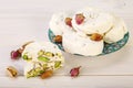 Traditional Iranian and Persian pieces of white nougat dessert sweet candies Gaz with Pistachio Royalty Free Stock Photo