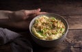 Traditional Irish dish colcannon, mashed potatoes with cabbage and green onions, on top of crispy fried cabbage topping with nuts