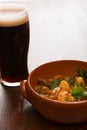 Traditional Irish Stew and a pint of beer in backlit Royalty Free Stock Photo