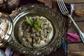 Traditional Islamic Feast, Festival of Sacrifice meal, braised meat and rice in the stylish metal bowl.