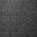 Traditional islamic rhythmic arabesque pattern in form of embossing on metal. Textured black silver backdrop with geometric