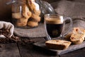 Traditional Italian almond biscuits biscotti served on a wooden board with a cup of aromatic coffee Royalty Free Stock Photo