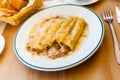 Traditional Italian cannelloni stuffed with minced meat baked in bechamel sauce Royalty Free Stock Photo