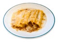 Traditional Italian cannelloni stuffed with minced meat baked in bechamel sauce Royalty Free Stock Photo