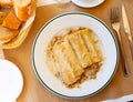 Traditional Italian cannelloni stuffed with minced meat baked in bechamel sauce Royalty Free Stock Photo