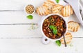 Traditional Italian Caponata and toast on a wooden white table. Royalty Free Stock Photo