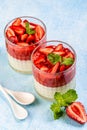 Traditional italian dessert vanilla strawberry panna cotta. vertical image. top view. place for text Royalty Free Stock Photo