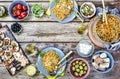 Italian food table, classic pasta, tomato sauce, eating outdoor, various European snacks,abundance of products, top view. copy spa Royalty Free Stock Photo