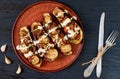 Traditional Italian dish - grilled eggplants stuffed with rise, tomatoes, garlic and sauce on a vintage plate Royalty Free Stock Photo