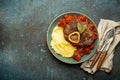 Traditional Italian dish Ossobuco all Milanese made with cut veal shank meat with vegetable tomato sauce served with Royalty Free Stock Photo