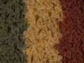 Traditional italian farfalle pasta in national flag tricolor style.
