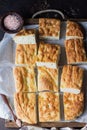 Traditional Italian focaccia bread with salt and olive oil. Homemade flat bread focaccia. Royalty Free Stock Photo