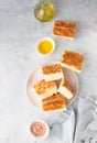 Traditional Italian focaccia bread with salt and olive oil. Homemade flat bread focaccia. Focaccia Genovese. Royalty Free Stock Photo