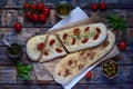 Traditional Italian Focaccia with tomatoes, basil, garlic and sumach. Homemade pastry. Flat bread. Organic flatbread. Rustic style Royalty Free Stock Photo